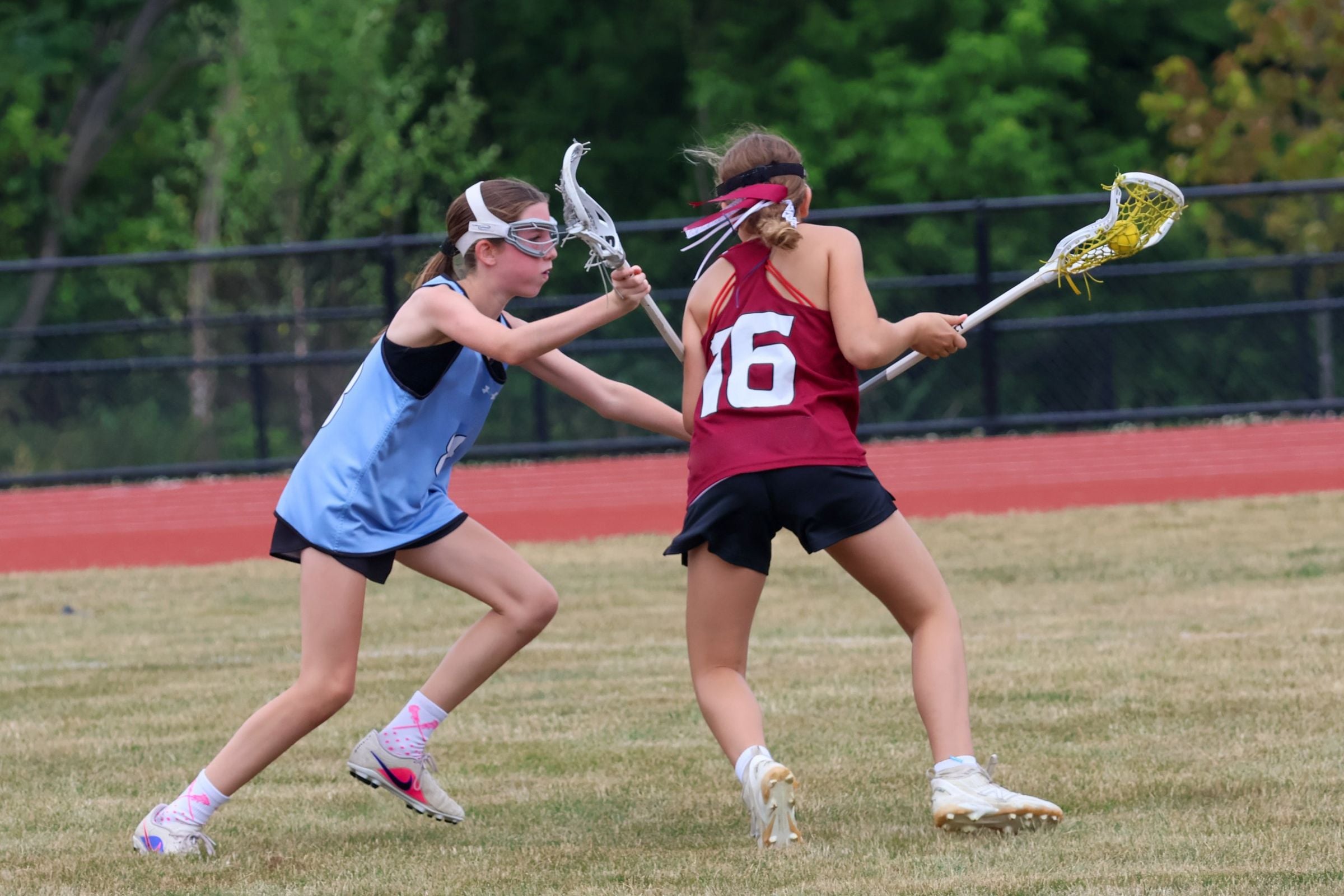 Attacker and defender battling for the ball