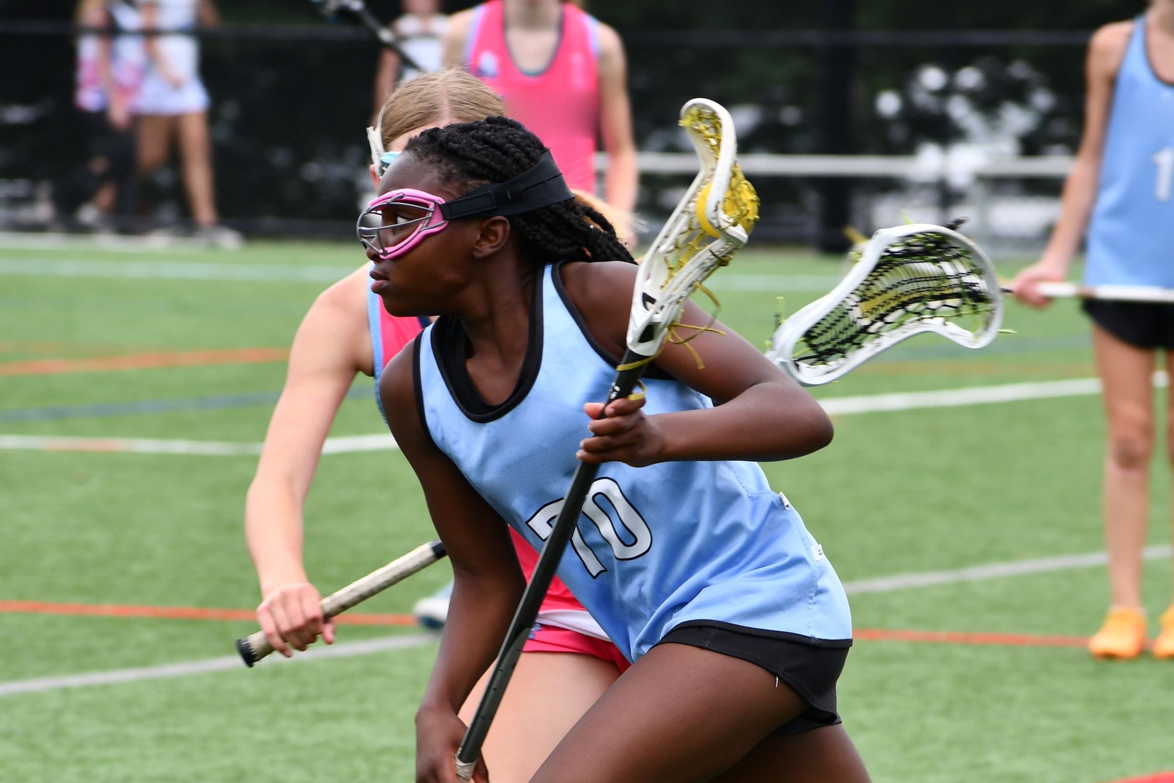 Youth lacrosse game in action