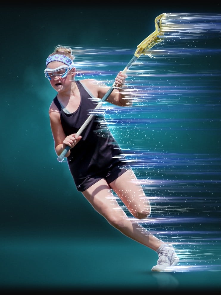 Lacrosse player cutting upfield with her stick, streaks of teal light behind her