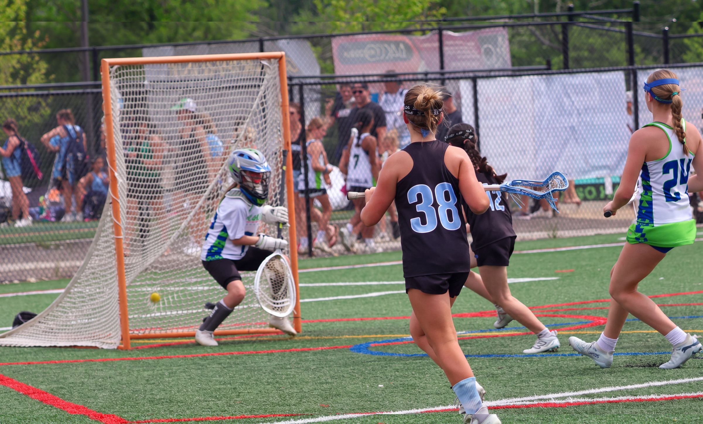 Lacrosse player driving to goal
