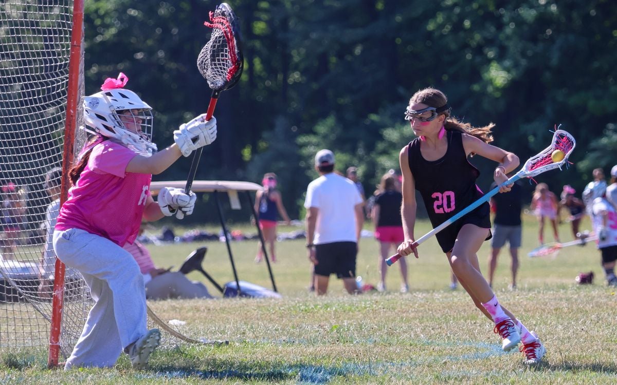 Lacrosse players on the field