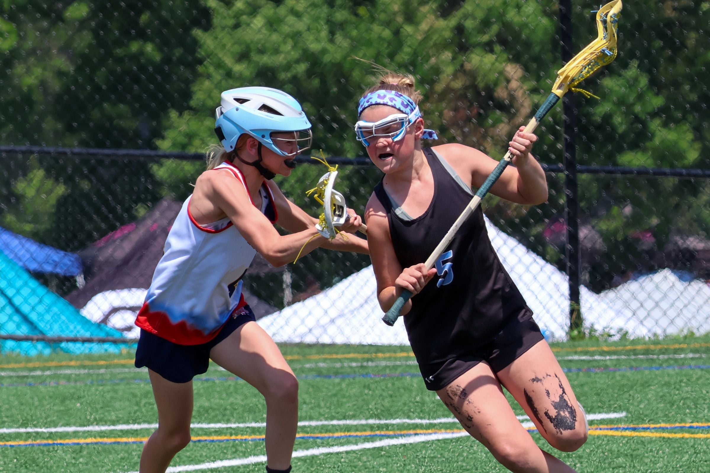 Youth lacrosse game in action