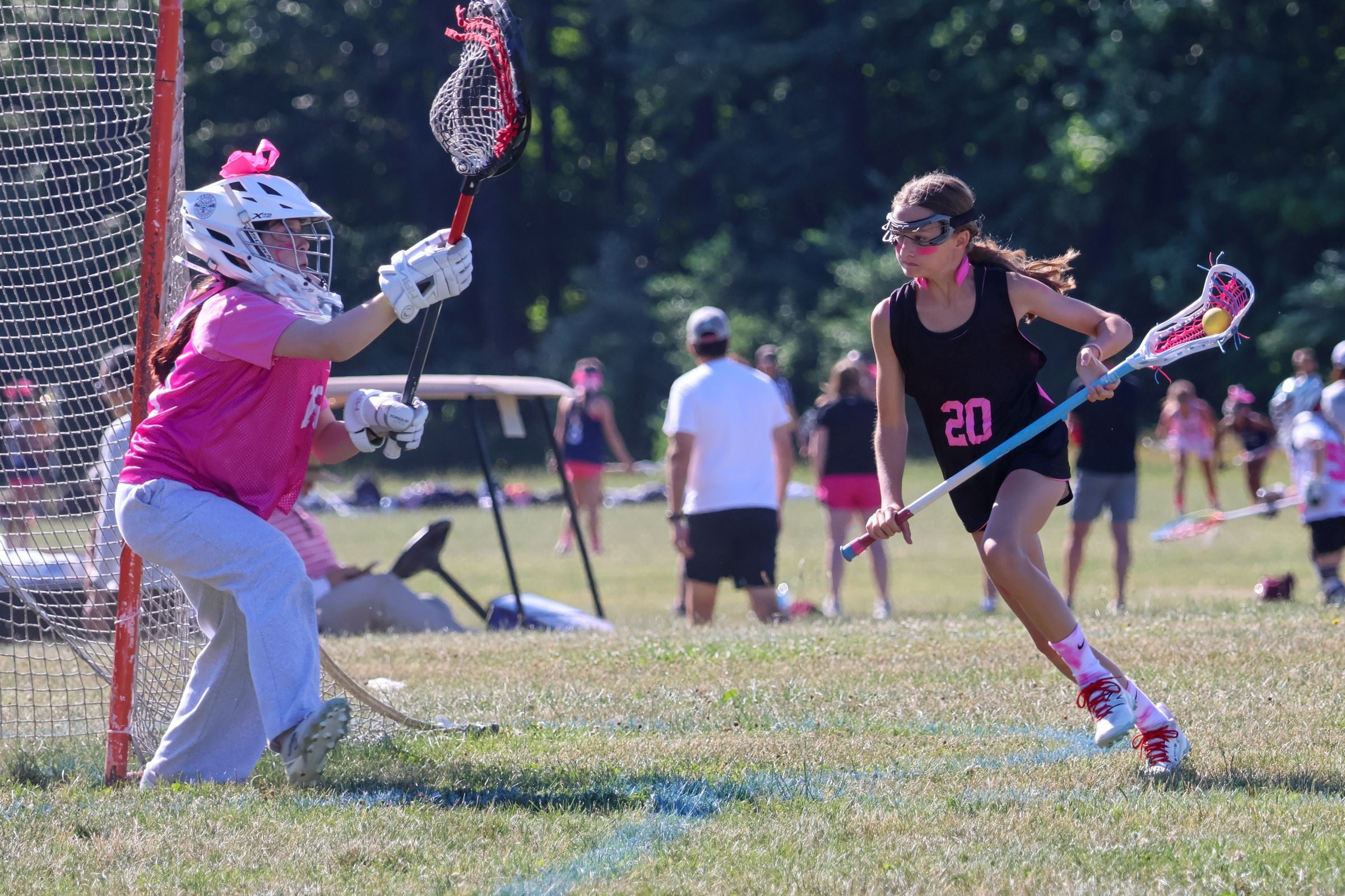 Youth lacrosse game in action
